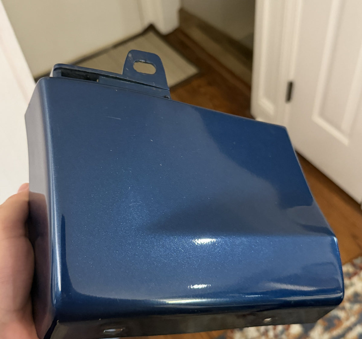 The intact blue trim piece from the other side of the car, before scanning