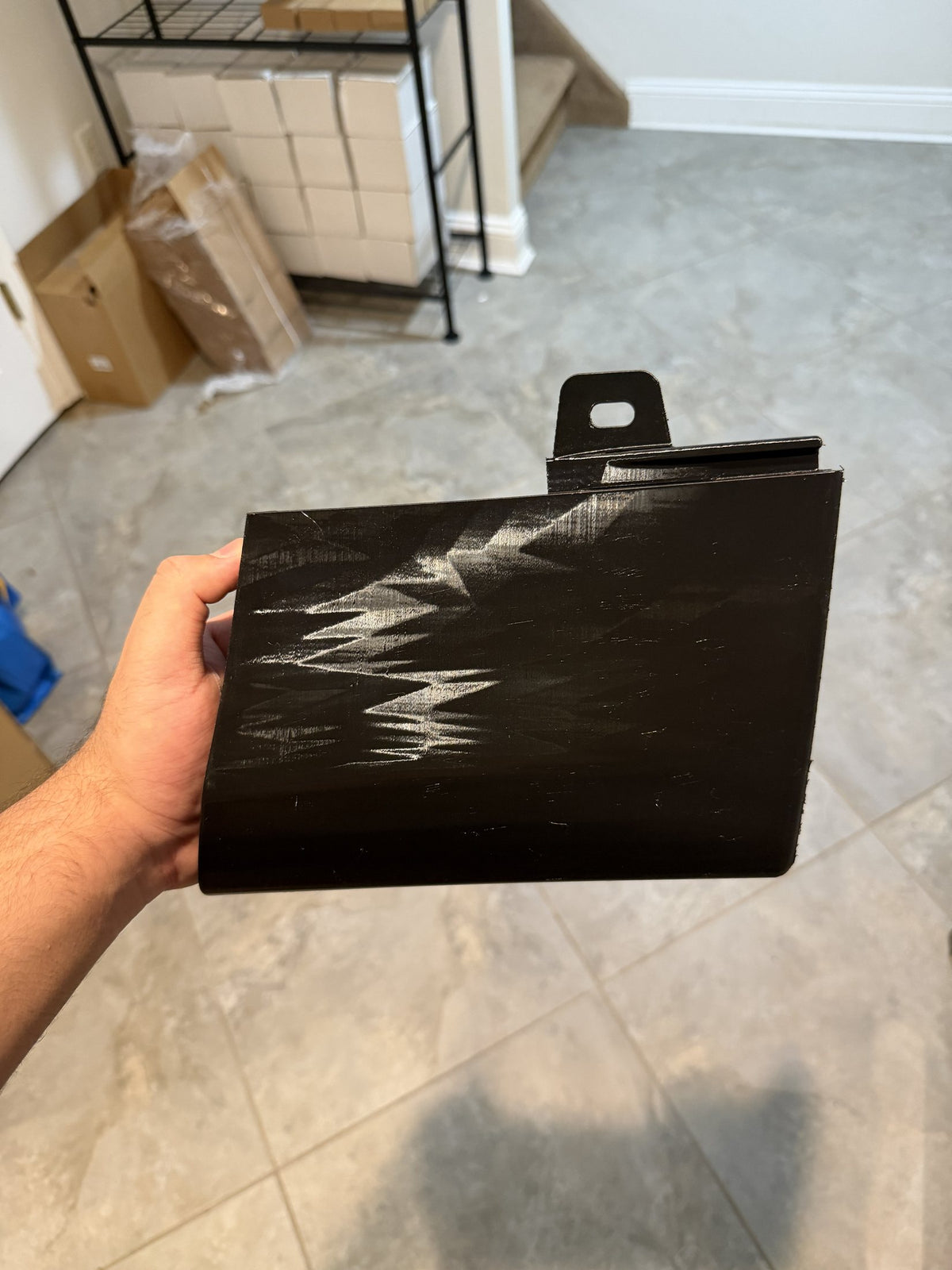 The new trim piece, printed in black PETG