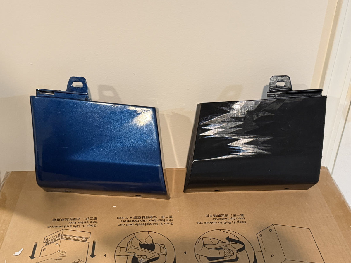 The original blue trim piece next to the printed black one, its mirror image